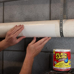 Flex Tape on a roof demonstrates firm adhesion across uneven shingles.