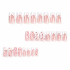 Foccna nails with glossy finish and 3D rhinestones for a chic look.