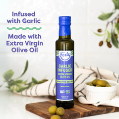 Fody Garlic Infused Olive Oil atop a fresh salad, savory and vibrant.