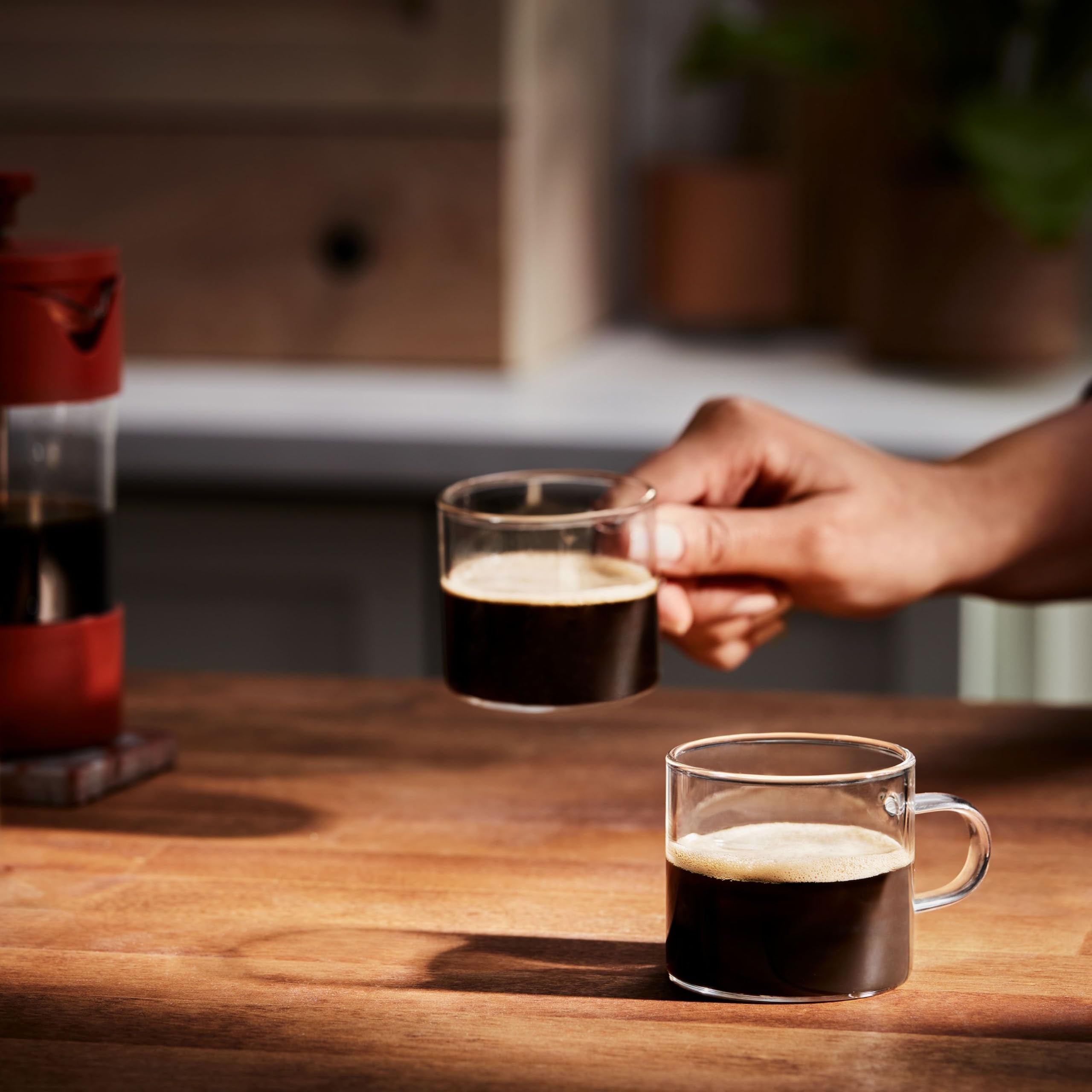 Folgers decaf coffee pours into a mug, ideal for evenings.