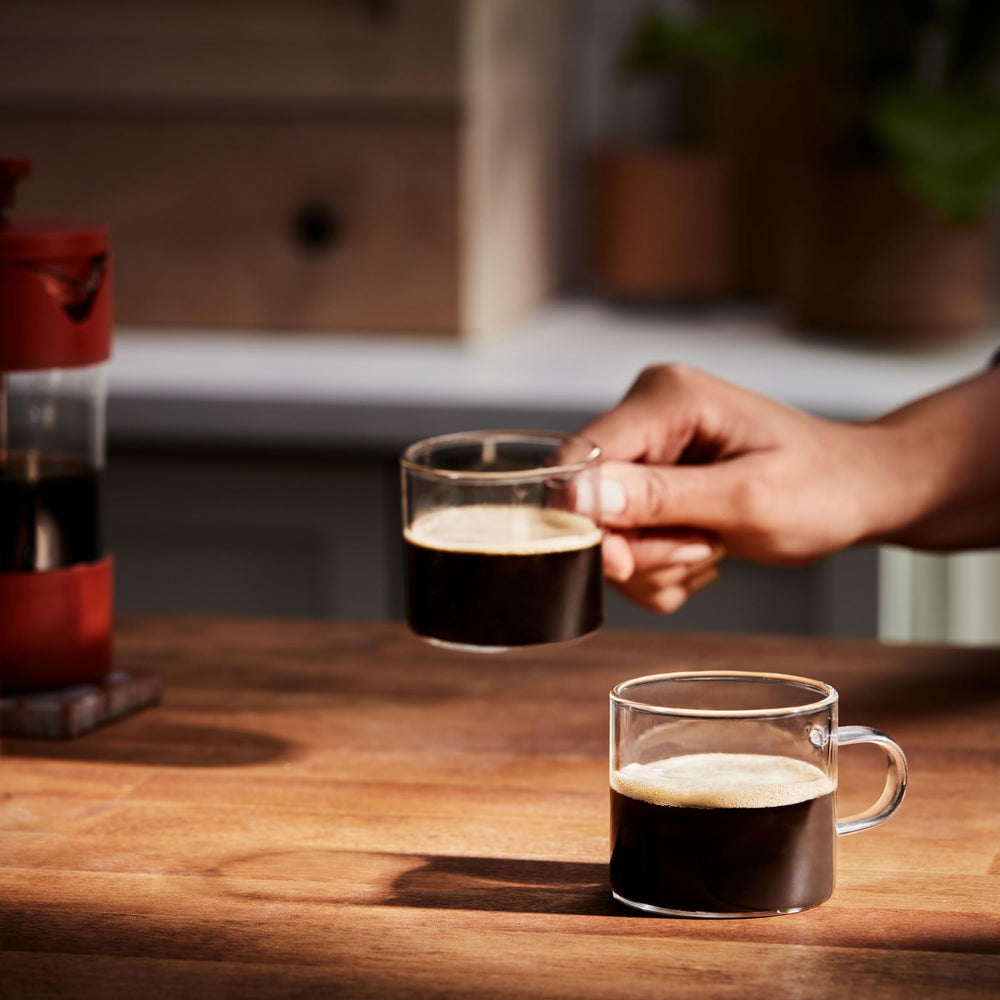 Folgers decaf coffee pours into a mug, ideal for evenings.