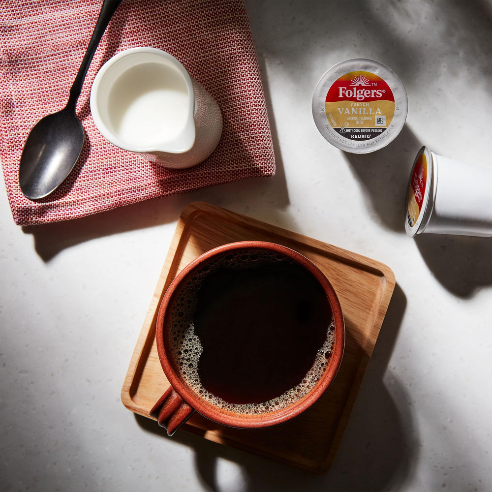 Mug of Folgers French Vanilla ready to be customized with creamer.
