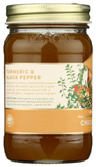 Fond turmeric spice bottle label highlights natural flavor boosters for recipes.