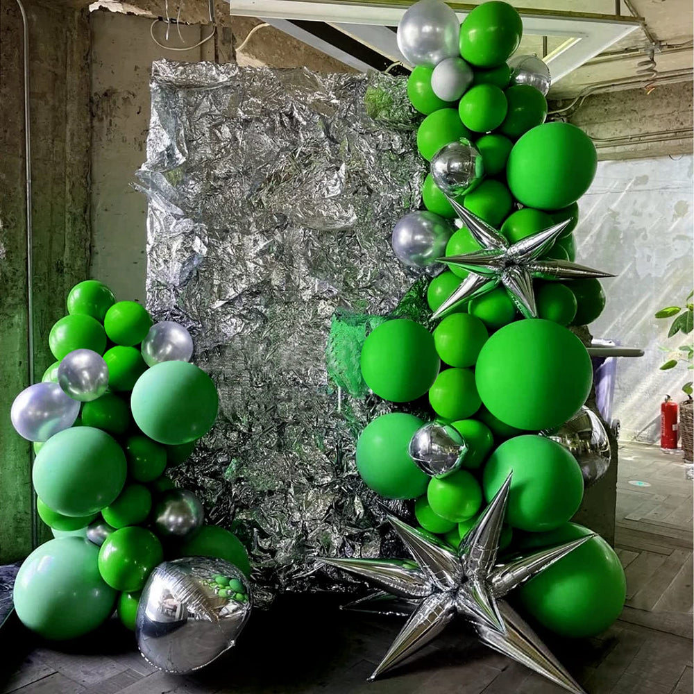 FOTIOMRG green balloons add Christmas decor flair.