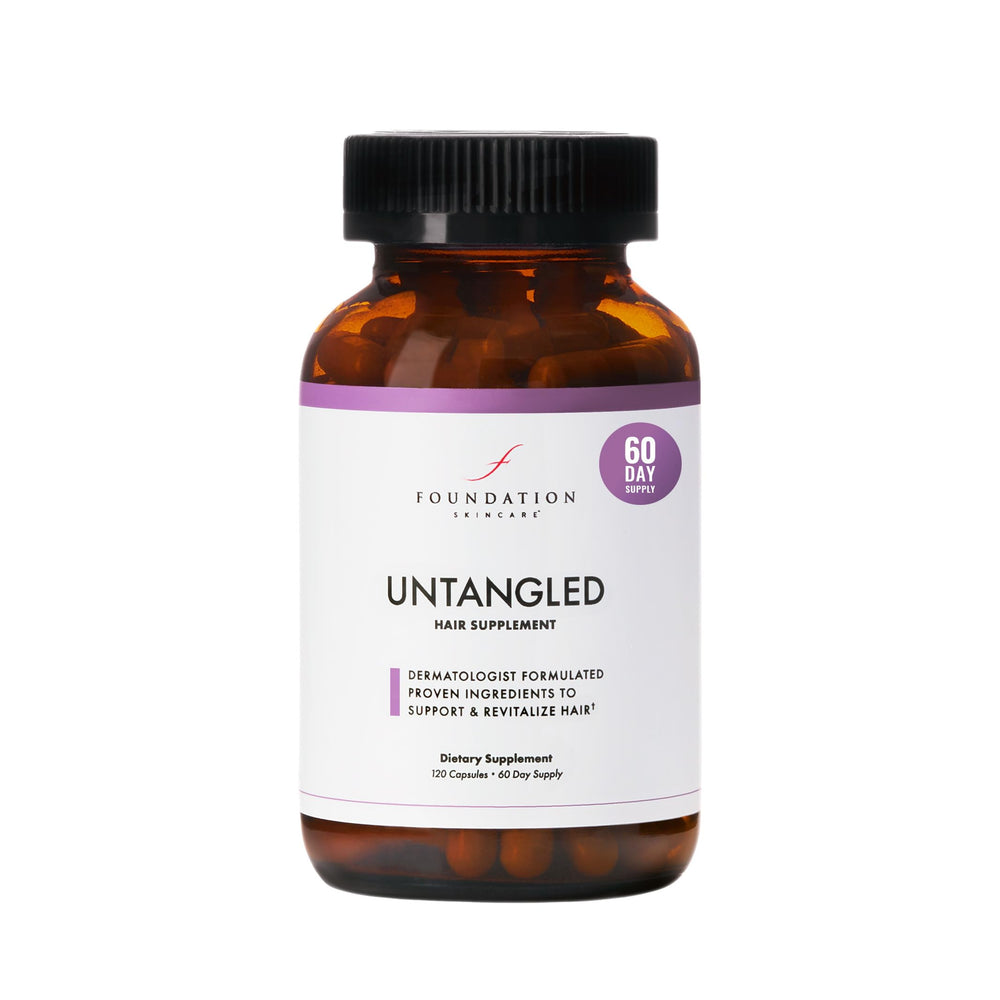 Foundation Skincare UnTangled Hair Vitamins bottle on a vanity suggesting hair growth support
