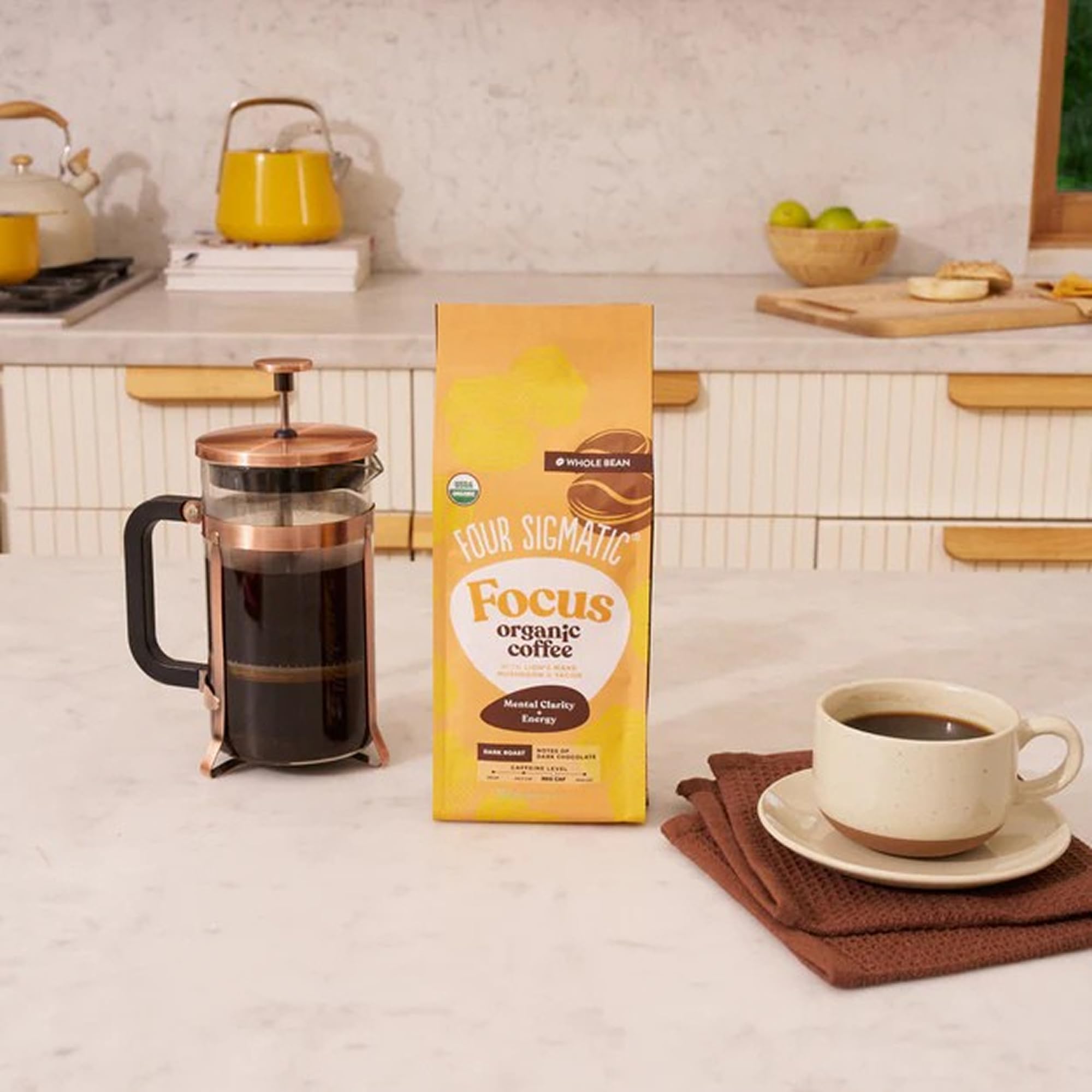 Close-up of a Four Sigmatic coffee cup showing crema and deep aroma