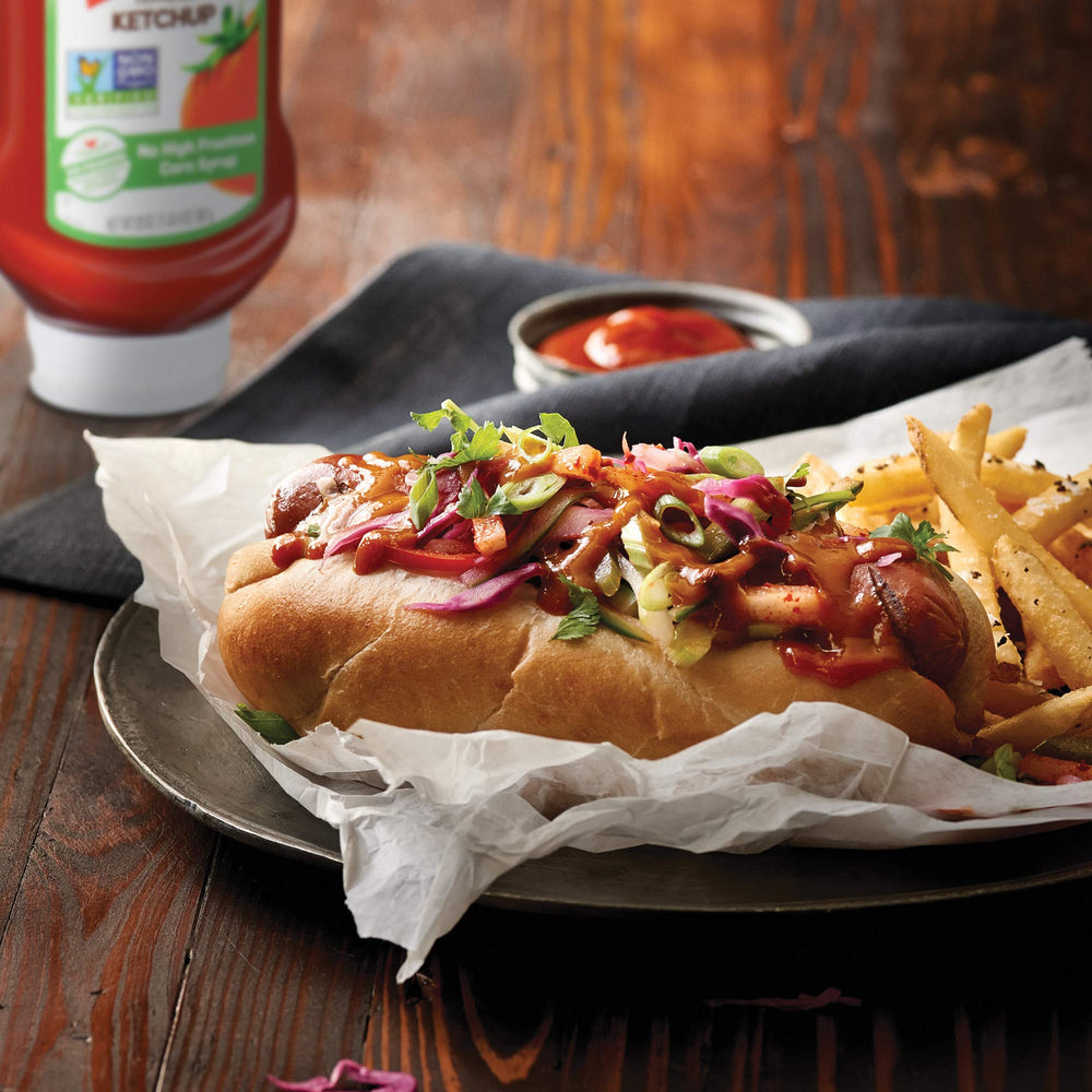 French's Tomato Ketchup topping on a burger for a glossy finish.