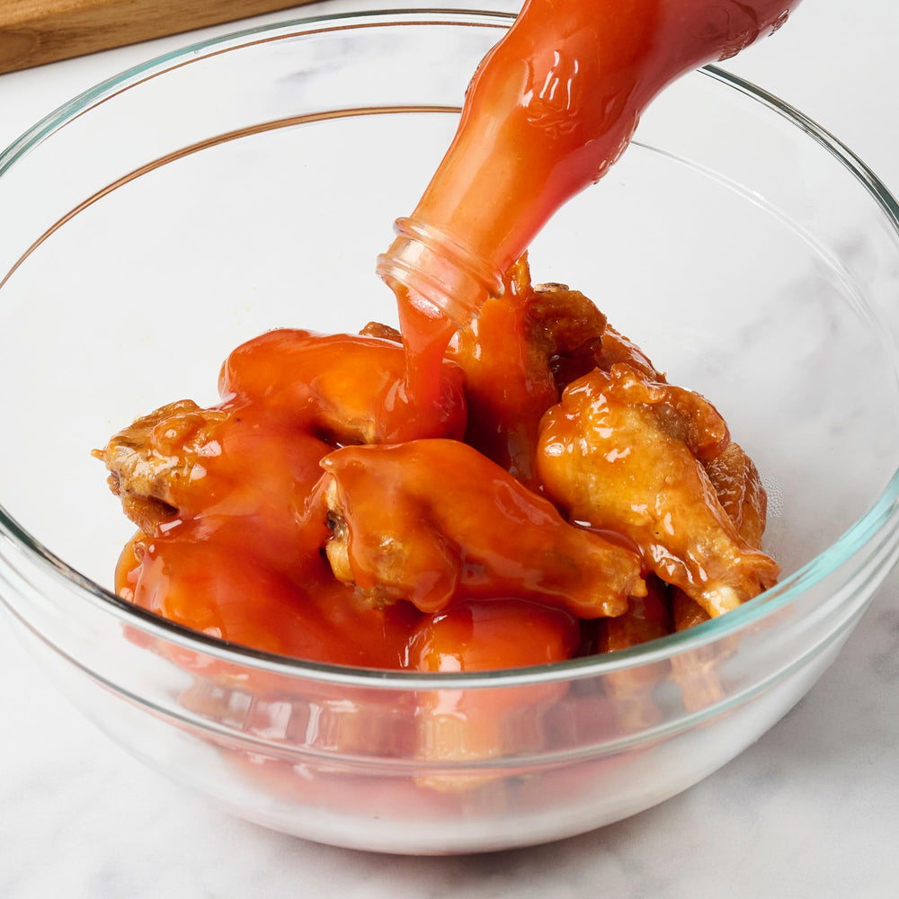 Kitchen counter with Frank's RedHot Buffalo Wings Sauce ready to use