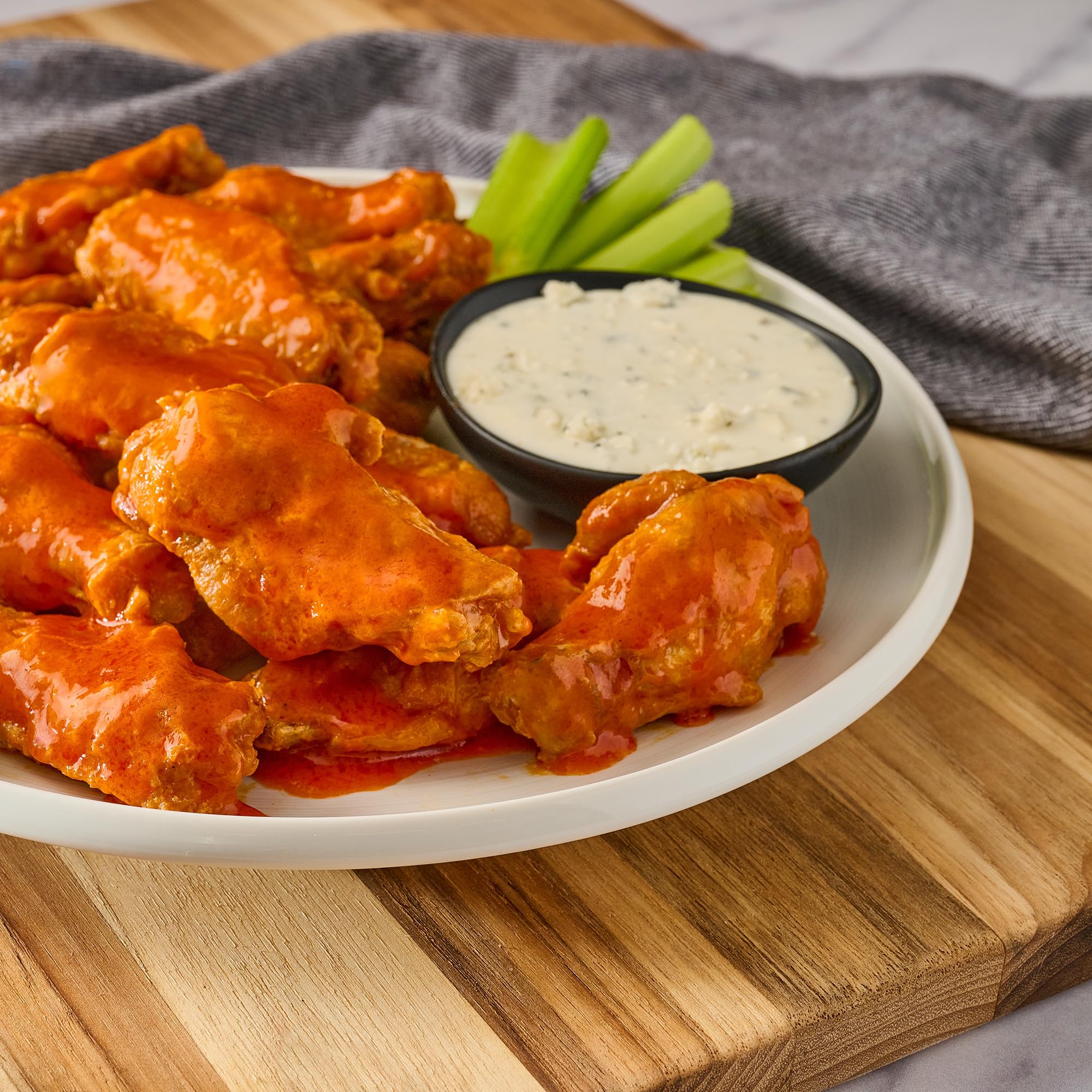 Wings plated with Frank's RedHot Buffalo Wings Sauce glaze