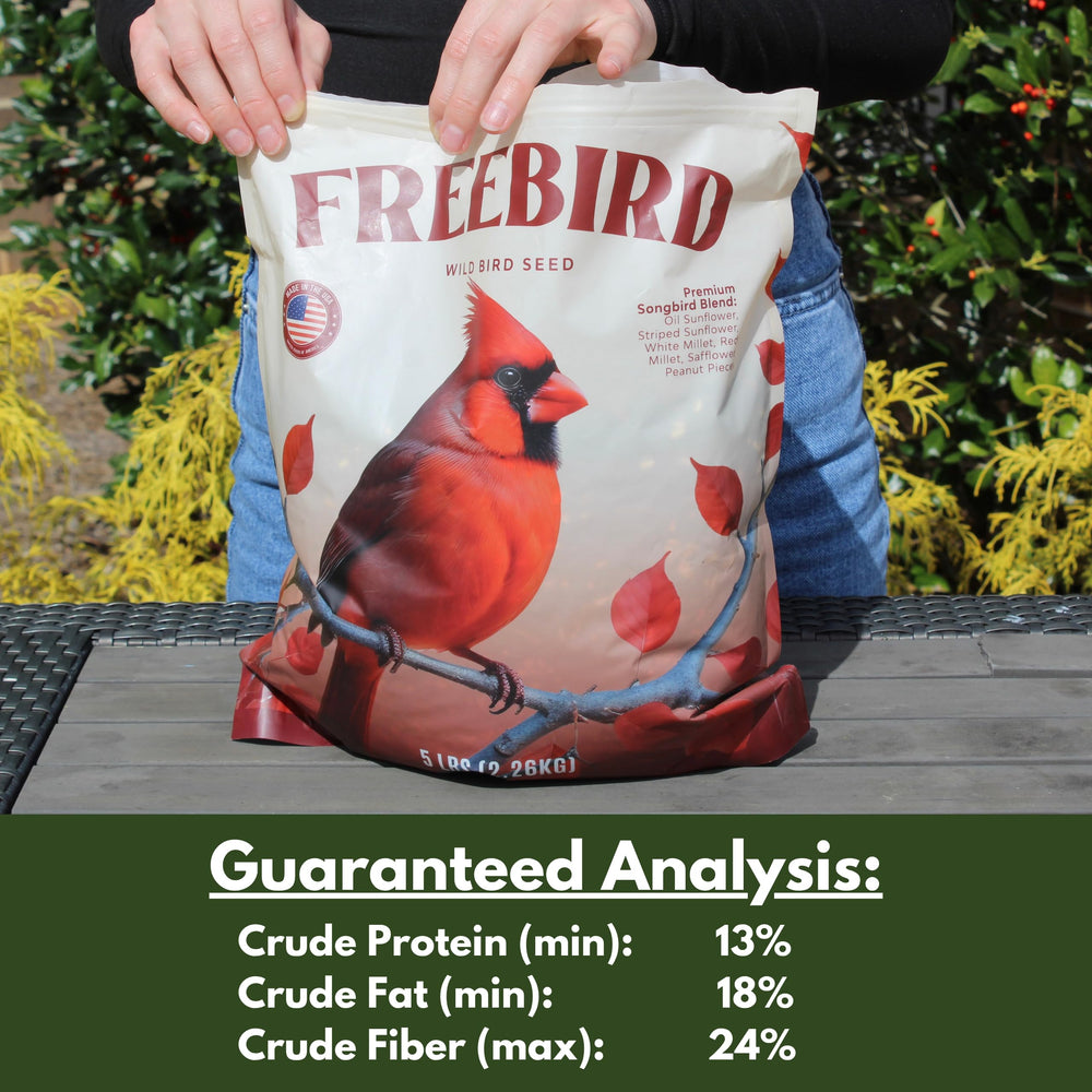 FREEBIRD Wild Bird Seed cardinals and finches in backyard setting.