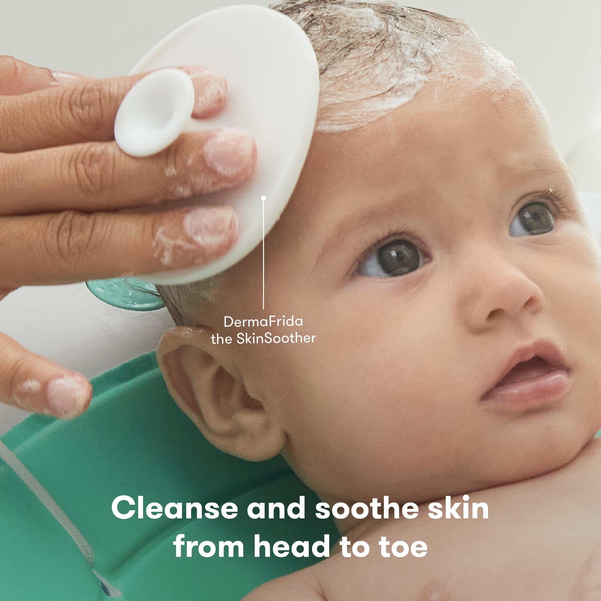 Frida Baby DermaFrida SkinSoother brush with silicone carry case for bath time care.