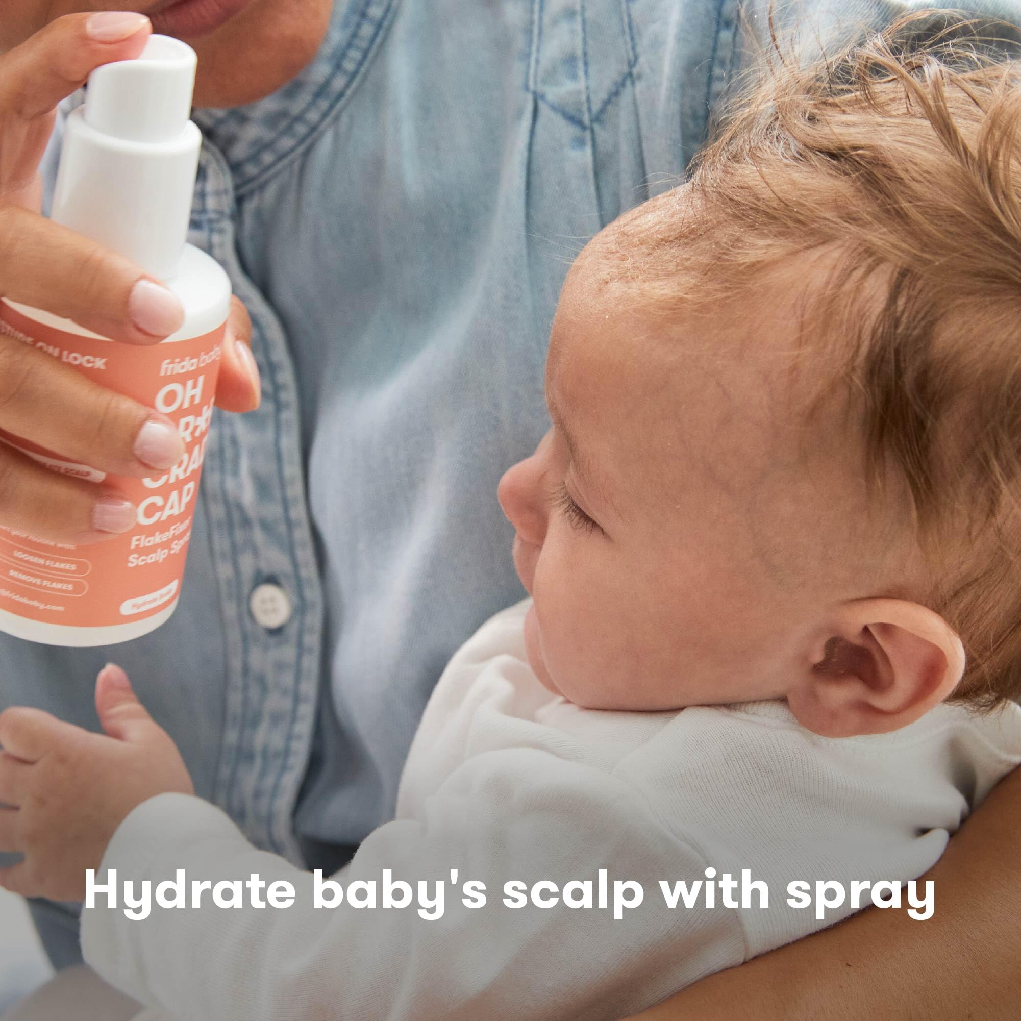 Frida Baby FlakeFixer brush used to gently loosen flakes