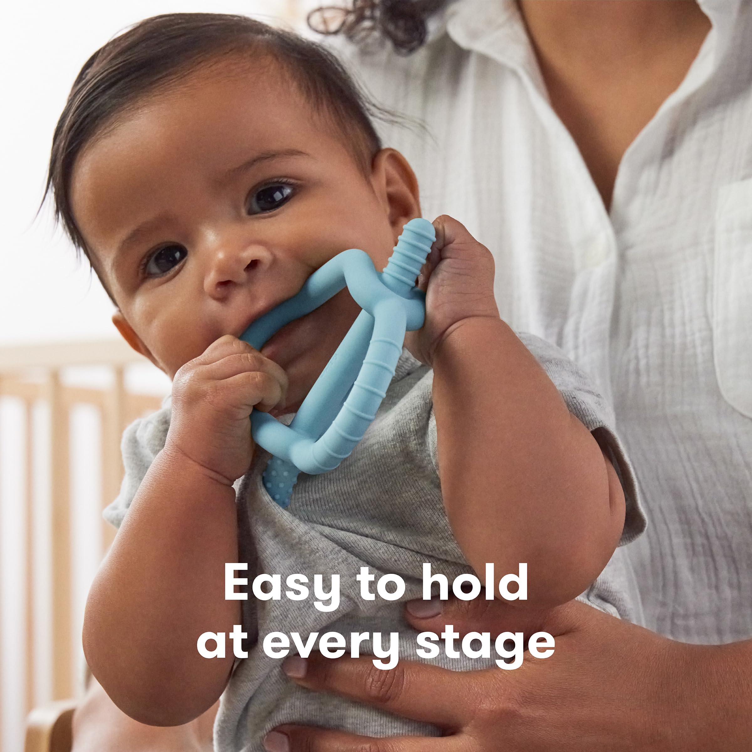 Frida Baby Get-A-Grip teether grows with baby as new teeth emerge.