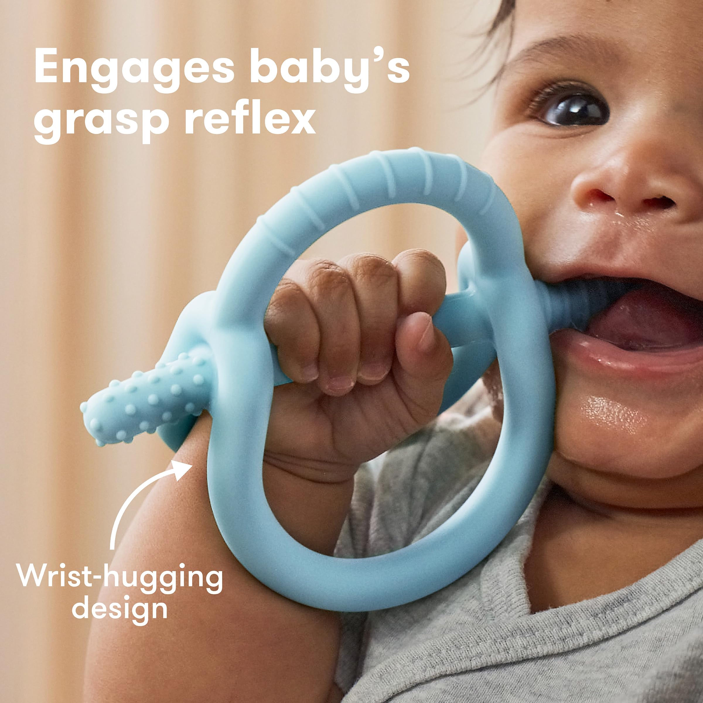 Frida Baby teether offers multiple textures for front and back teeth relief.
