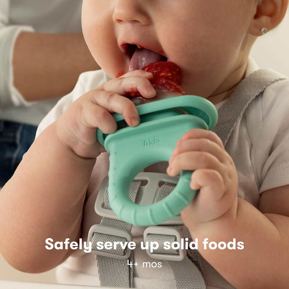 Frida Baby Push Pop Feeder teal tip ideal for loading fresh or frozen foods.