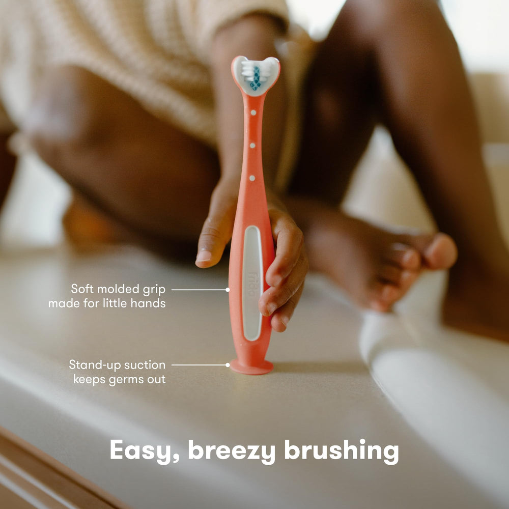 Frida Baby Toothhugger pink packaging highlights kid-friendly design