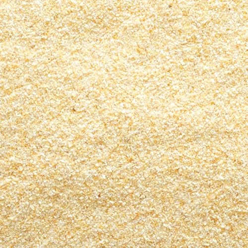 Frontier Co-op garlic granules scooped into a small bowl, ideal for quick seasoning.