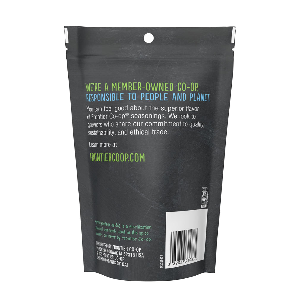 Frontier Co-op White Onion Powder pours from a bottle for easy seasoning