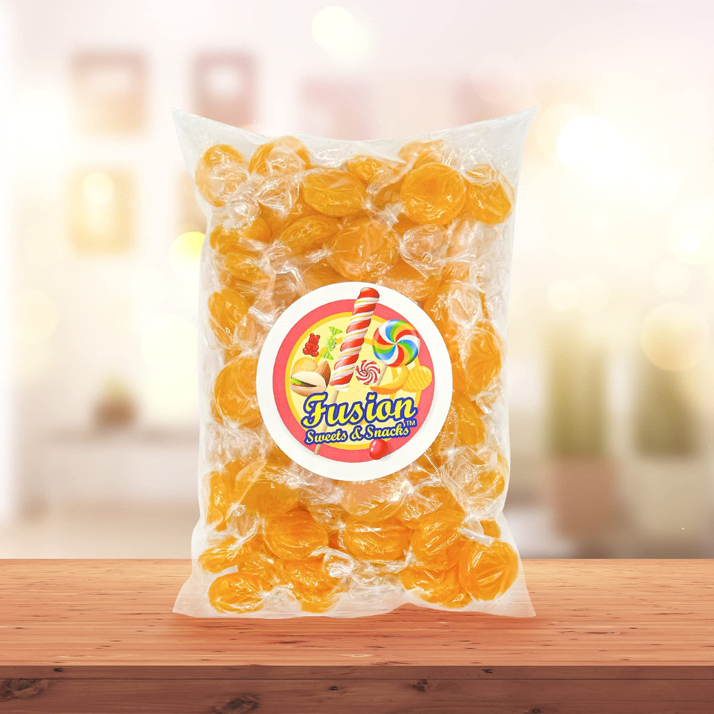 Fusion Sweets And Snacks butterscotch hard candy at a party table for guests.