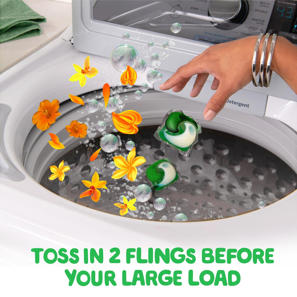 Gain Flings Island Fresh pacs dissolving in water demonstrate quick release.