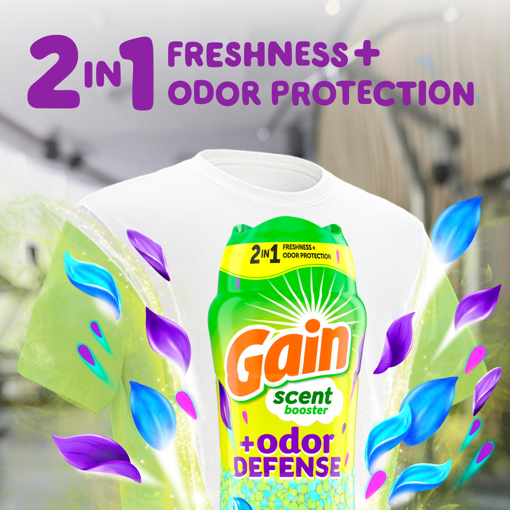 Beads being poured into washing machine for odor control