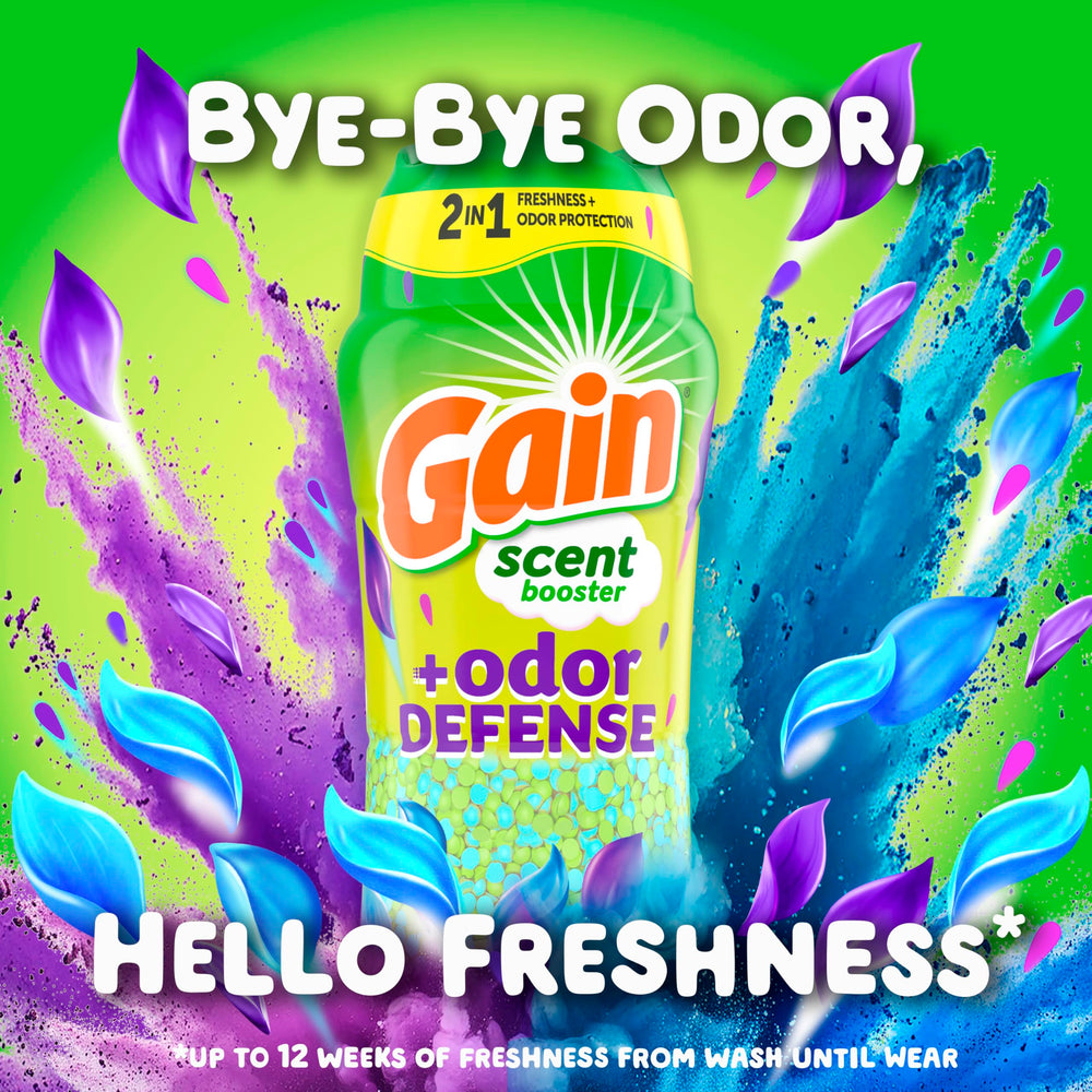Cap of the Gain Odor Defense booster beside a measuring scoop