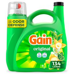 Gain Original bottle pour showing easy dosing and lasting freshness.