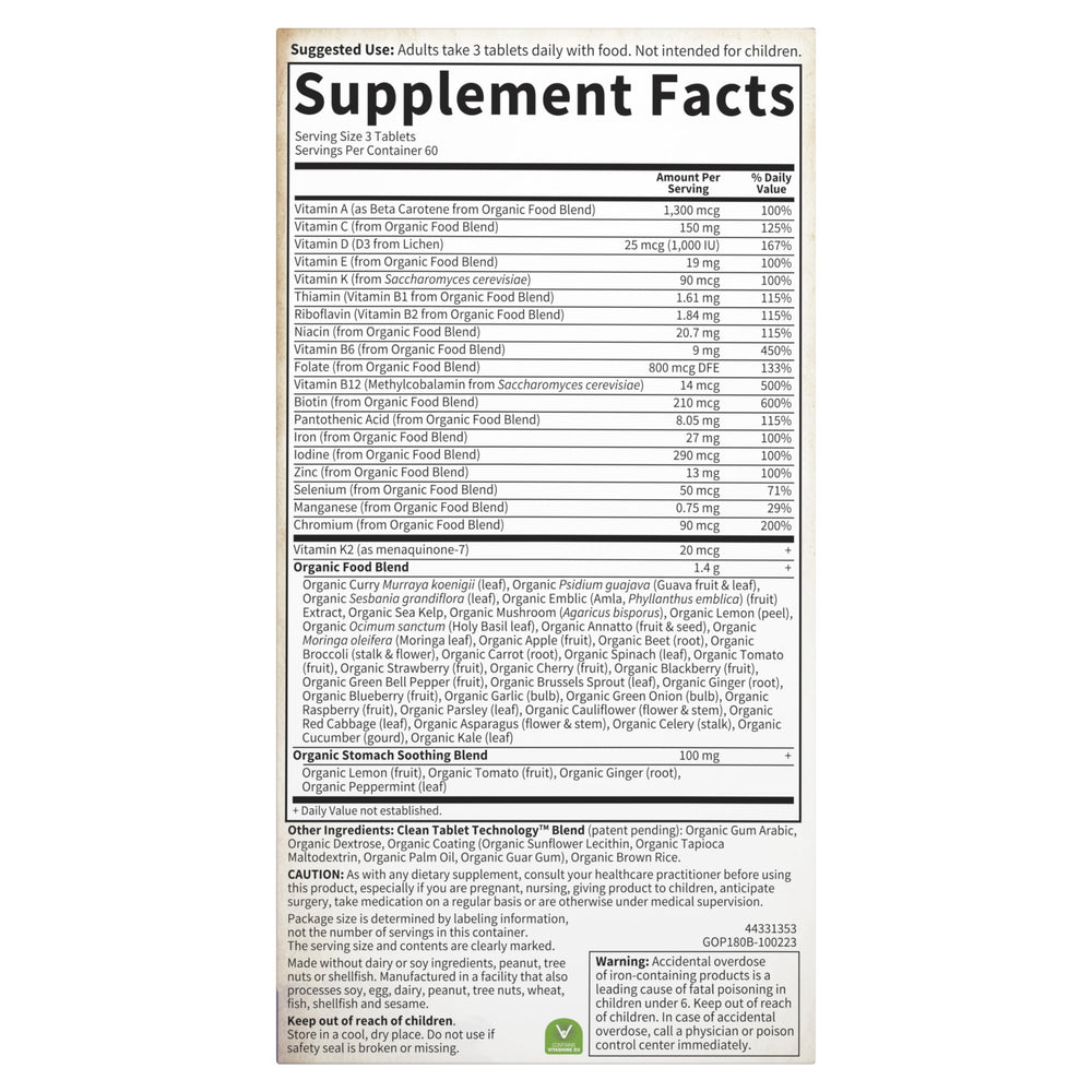 Expectant mom taking Garden of Life Organics Prenatal vitamins during daily routine.