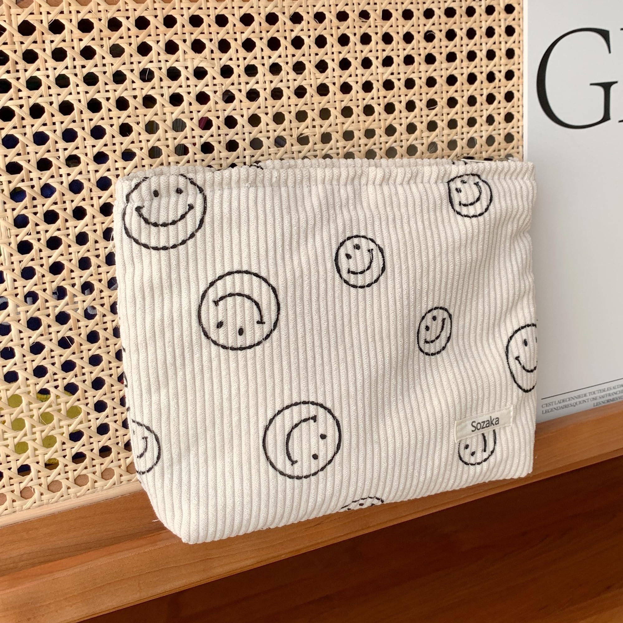 Gardsell corduroy bag open to reveal organized makeup, jewelry, and toiletries.