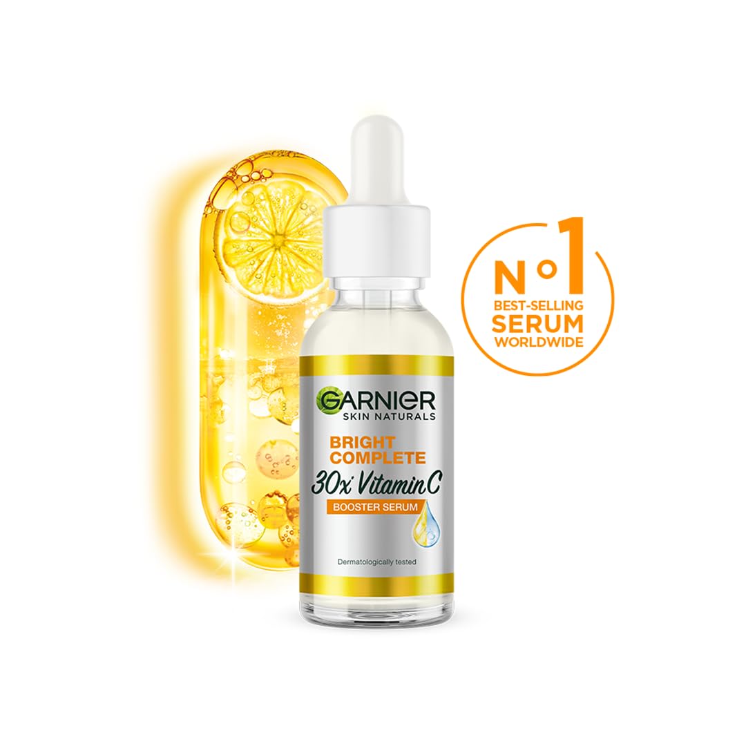Garnier Bright Complete serum dropper applied to cheek for even tone