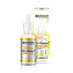 Garnier Bright Complete Vitamin C Booster bottle closeup showing potential brightening