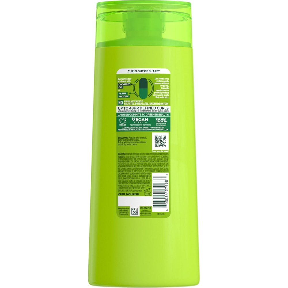 Garnier Fructis Curl Nourish Shampoo recycled packaging highlighting eco-friendly bottle.