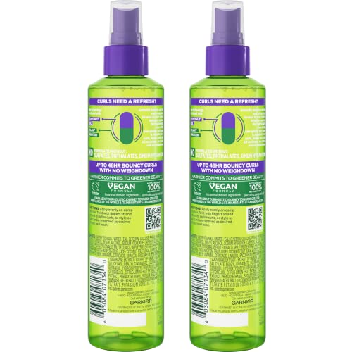 Garnier Fructis Curl Refresher mist applied to damp hair defining curls