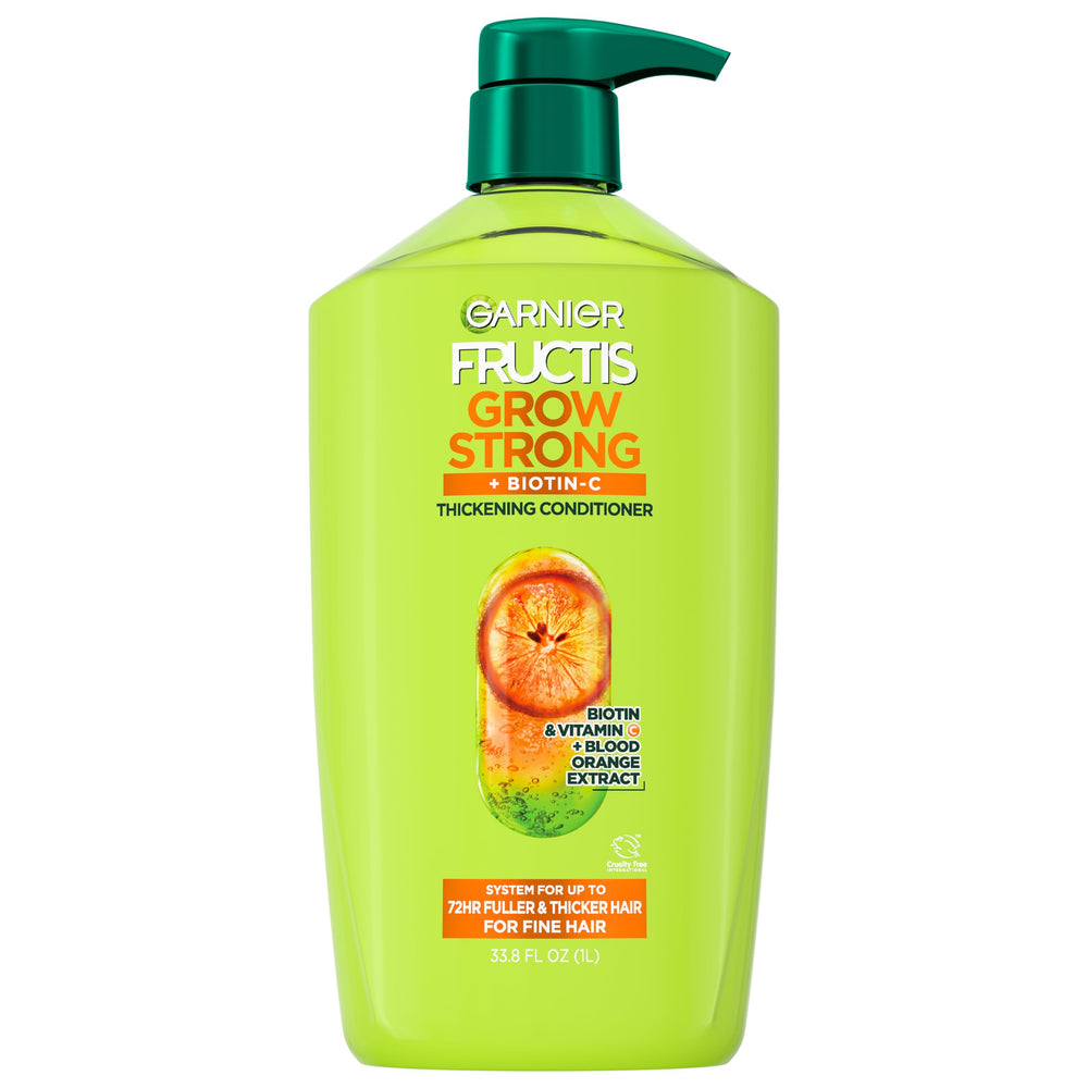 Garnier Fructis Grow Strong conditioner bottle highlighting fullness for fine hair.