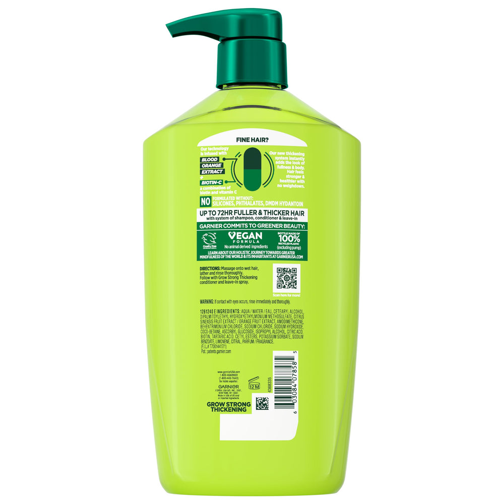 Garnier Fructis Grow Strong bottle on a shelf suggesting lightweight volume.