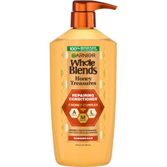 Garnier Honey Treasures Repairing Conditioner bottle shows strong, hydrated hair potential