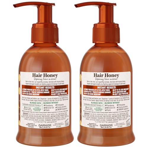 Garnier Whole Blends Honey Treasures Serum bottle close-up with eco-friendly recycled packaging.