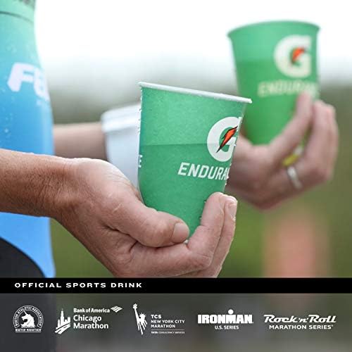 Gatorade Endurance Formula powder being stirred with water in a sports bottle.