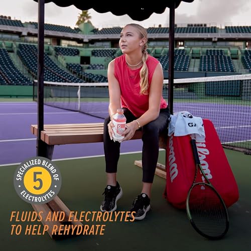Pouring Gatorlyte Zero into a glass after a workout for quick hydration