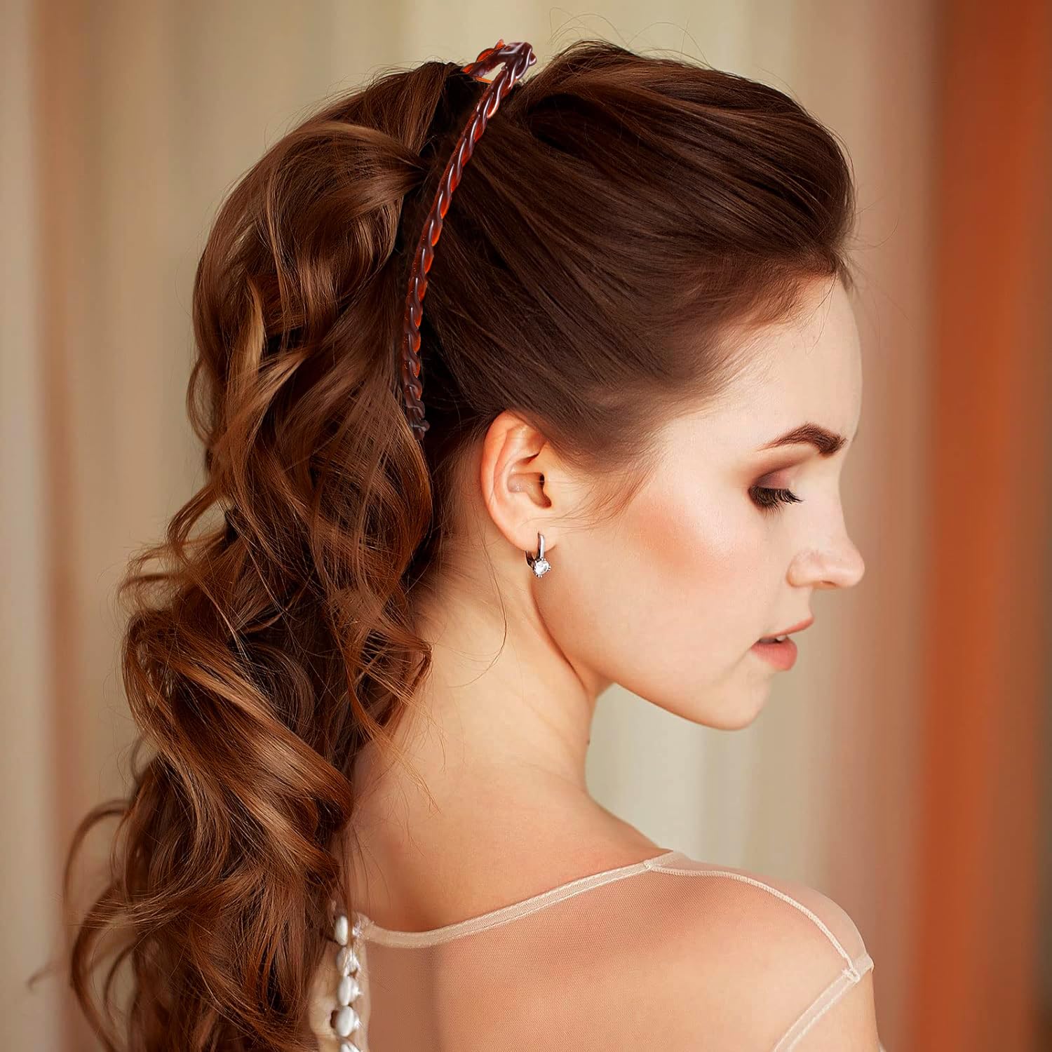 Generic Banana Clips shown with hair neatly gathered into a ponytail.