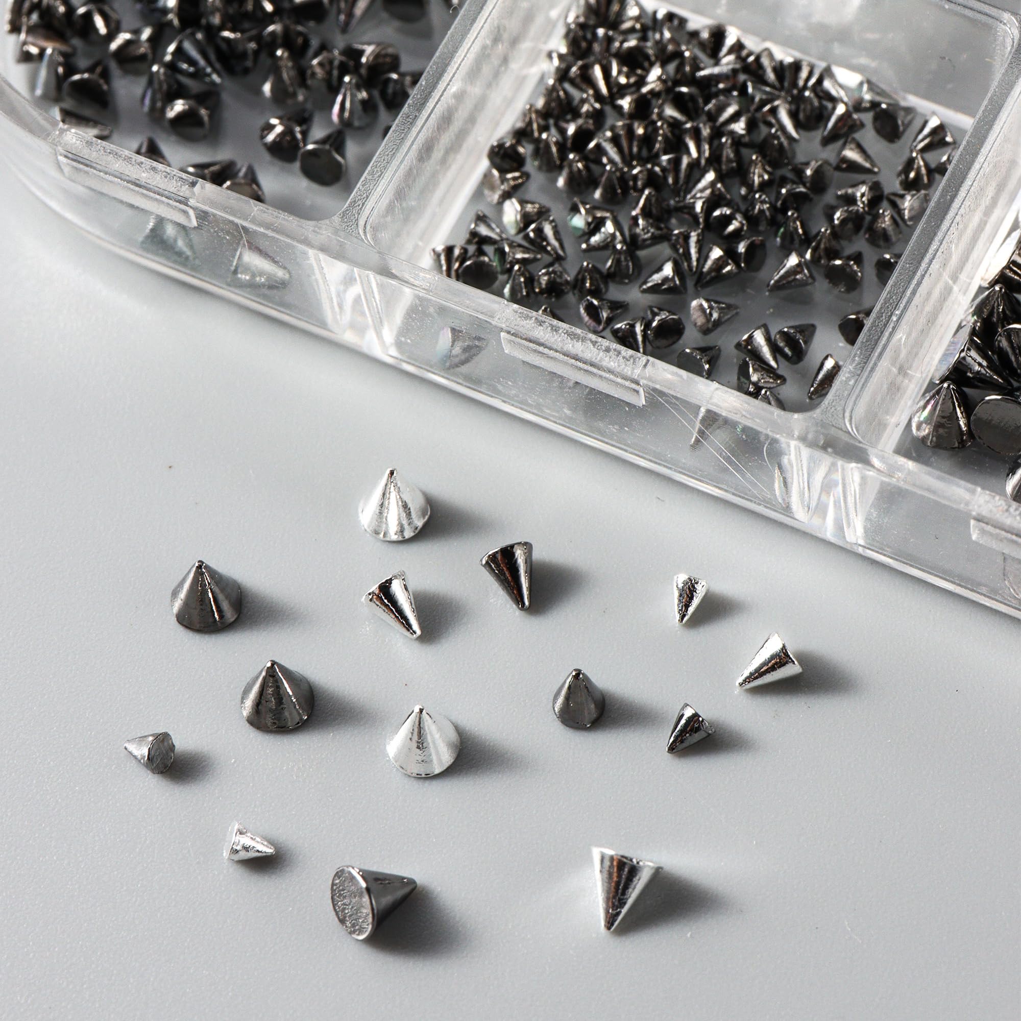 Generic punk goth charms offer dramatic 3D textures for standout manicures