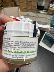 Application close-up of Genesis Wild Yam Root Cream demonstrating quick absorption.
