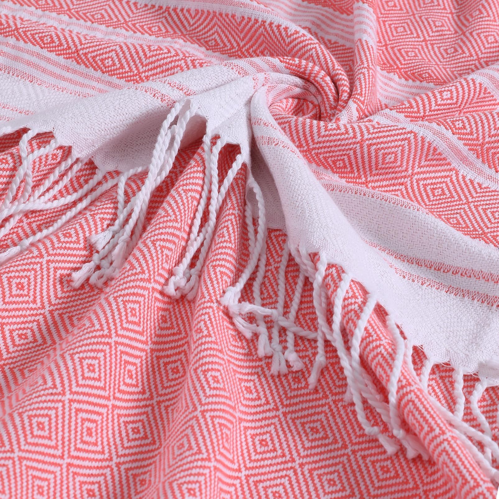 Genovega tassel-detail towel adds luxury to bath or spa.