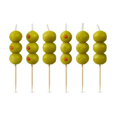 Genuine Fred cocktail olive candle on a wooden pick adds playful cake garnish