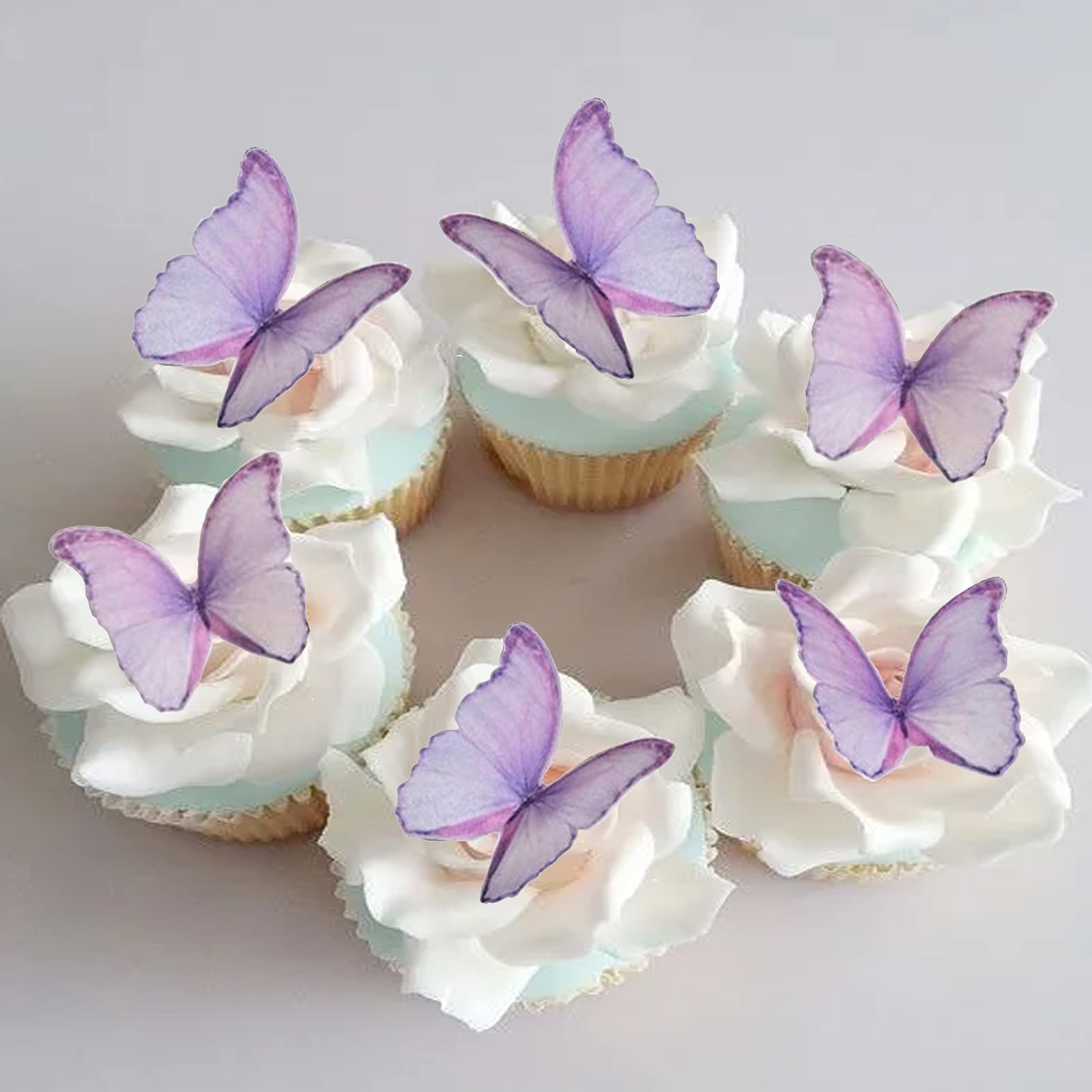 GEORLD edible wafer butterflies for cake decoration with a delicate purple hue and subtle 3D feel.