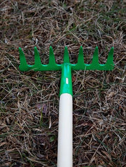 JustForKids rake with wood handle and steel head for tidy yard cleanup
