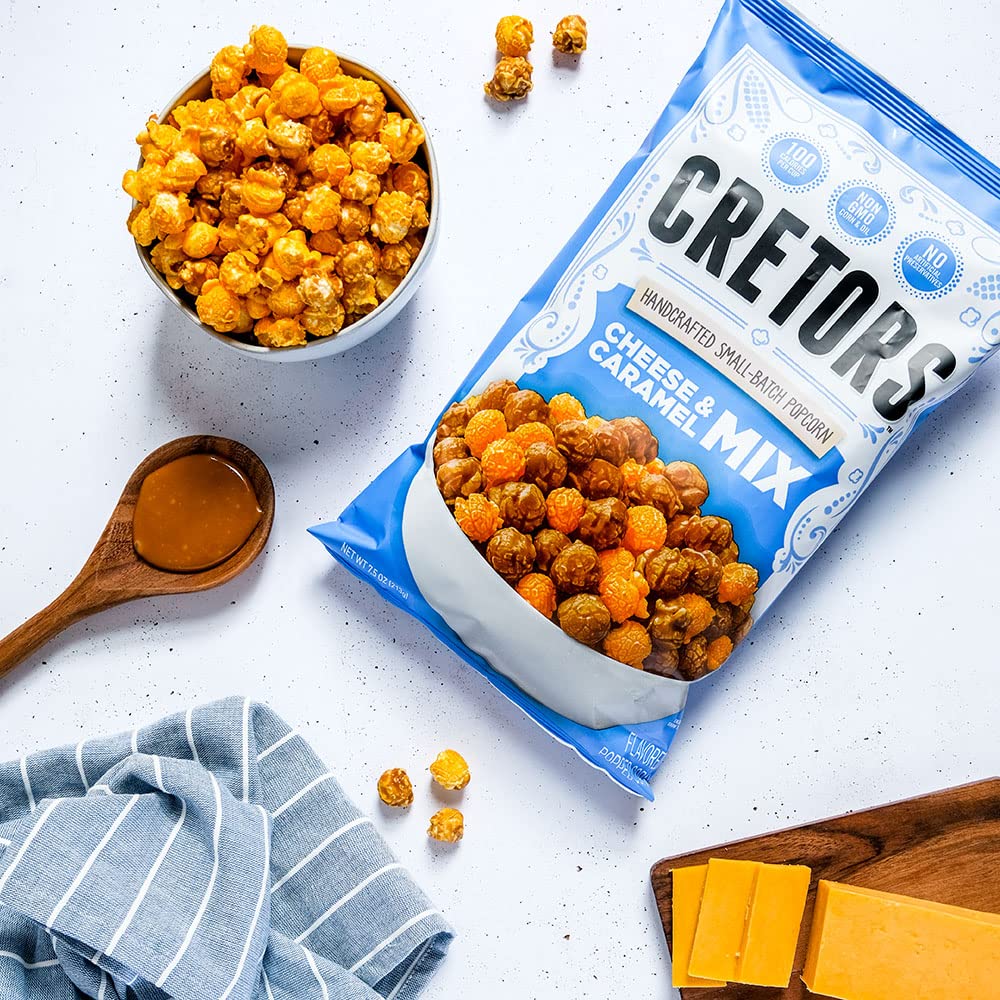 G.H. Cretors shelf display of cheese & caramel popcorn blend.
