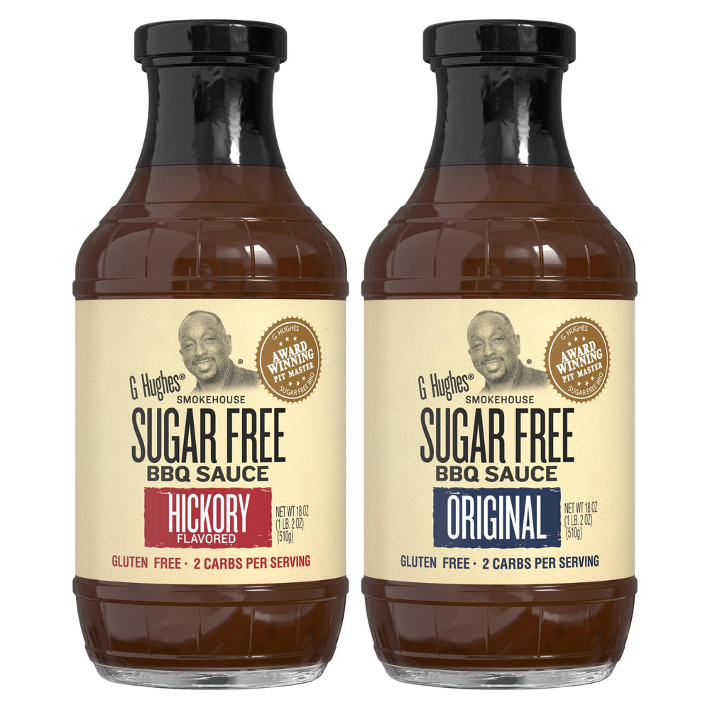 G Hughes Sugar Free Hickory BBQ sauce bottle on wood table for smoky grilling.