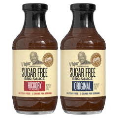 G Hughes Sugar Free Hickory BBQ sauce bottle on wood table for smoky grilling.
