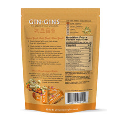 The Ginger People GIN GINS Mandarin Orange Chews close-up of ginger piece offering a zesty bite.